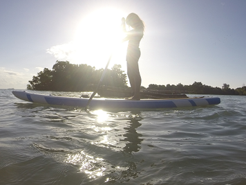 Woman on stand up paddle board Zanzibar